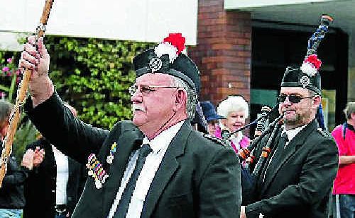 Greg Thouard leads the Stanthorpe and District Pipe Band. Greg Thouard leads the Stanthorpe and District Pipe Band.